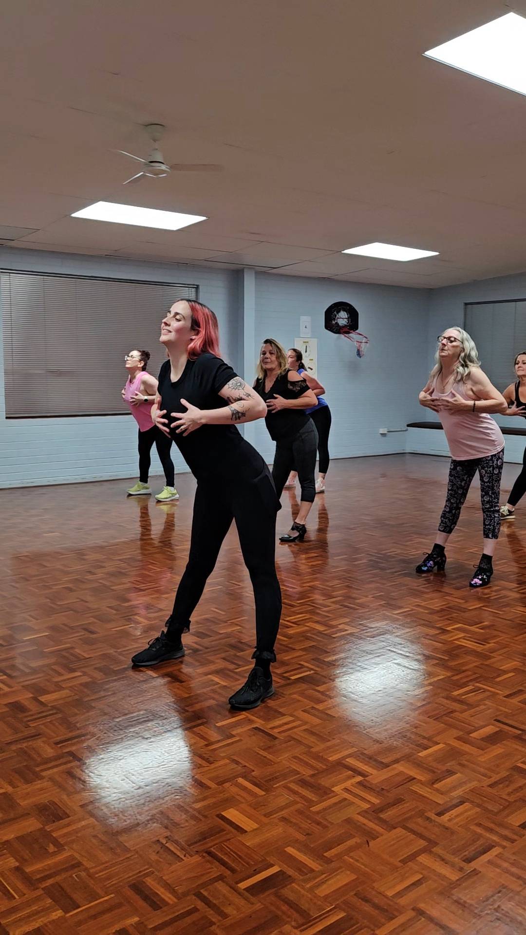 Dancers moving together in a Fierce Motion class